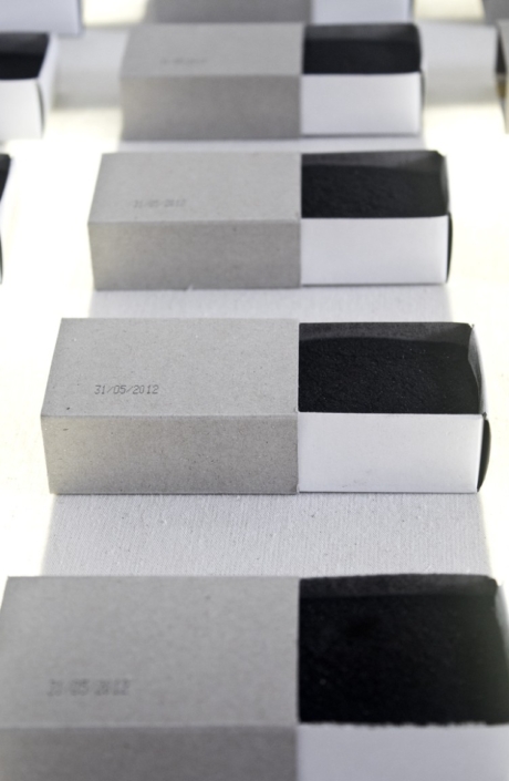 Joo-Hee Yang, Le Fond du Tiroir, 2015, 400 burnt matches box, neon, palette, fabric, 120 x 80 x 15cm